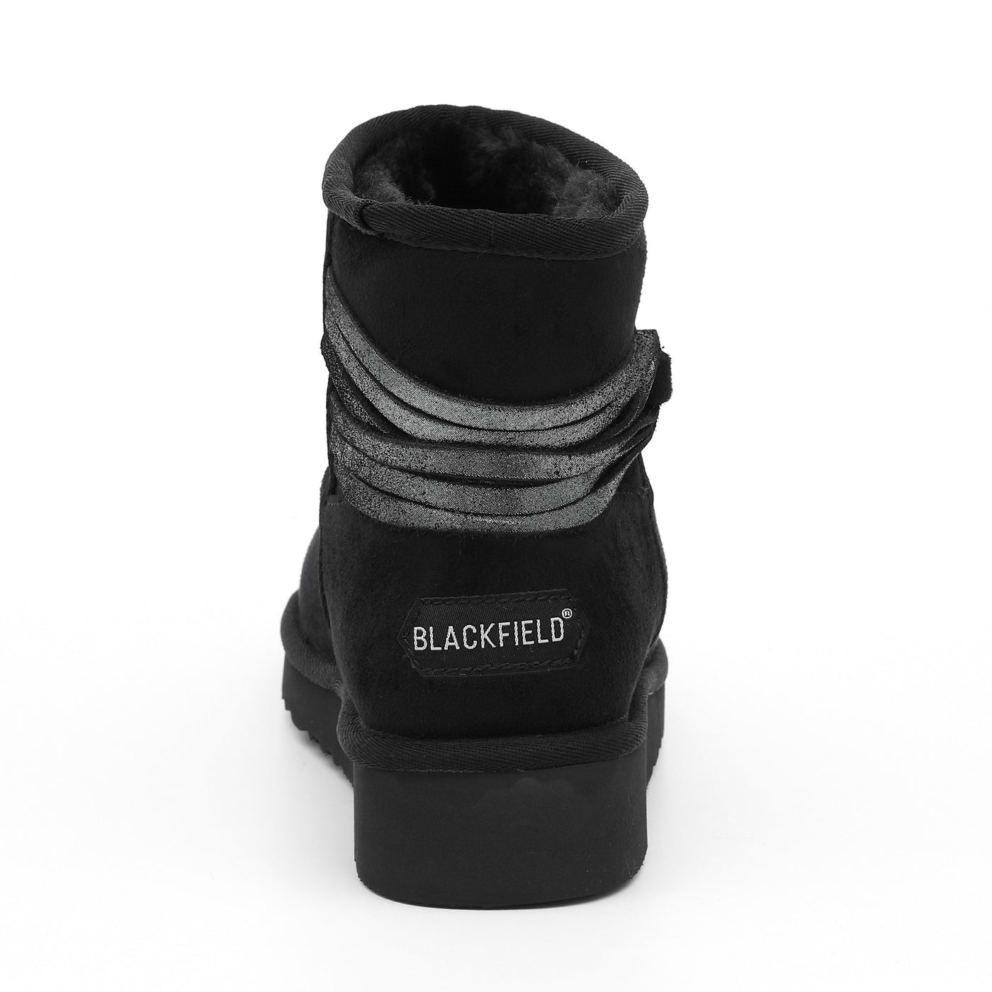 Bottine fourrée Dolce noire de dos, étiquette Blackfield blanche cousue au talon