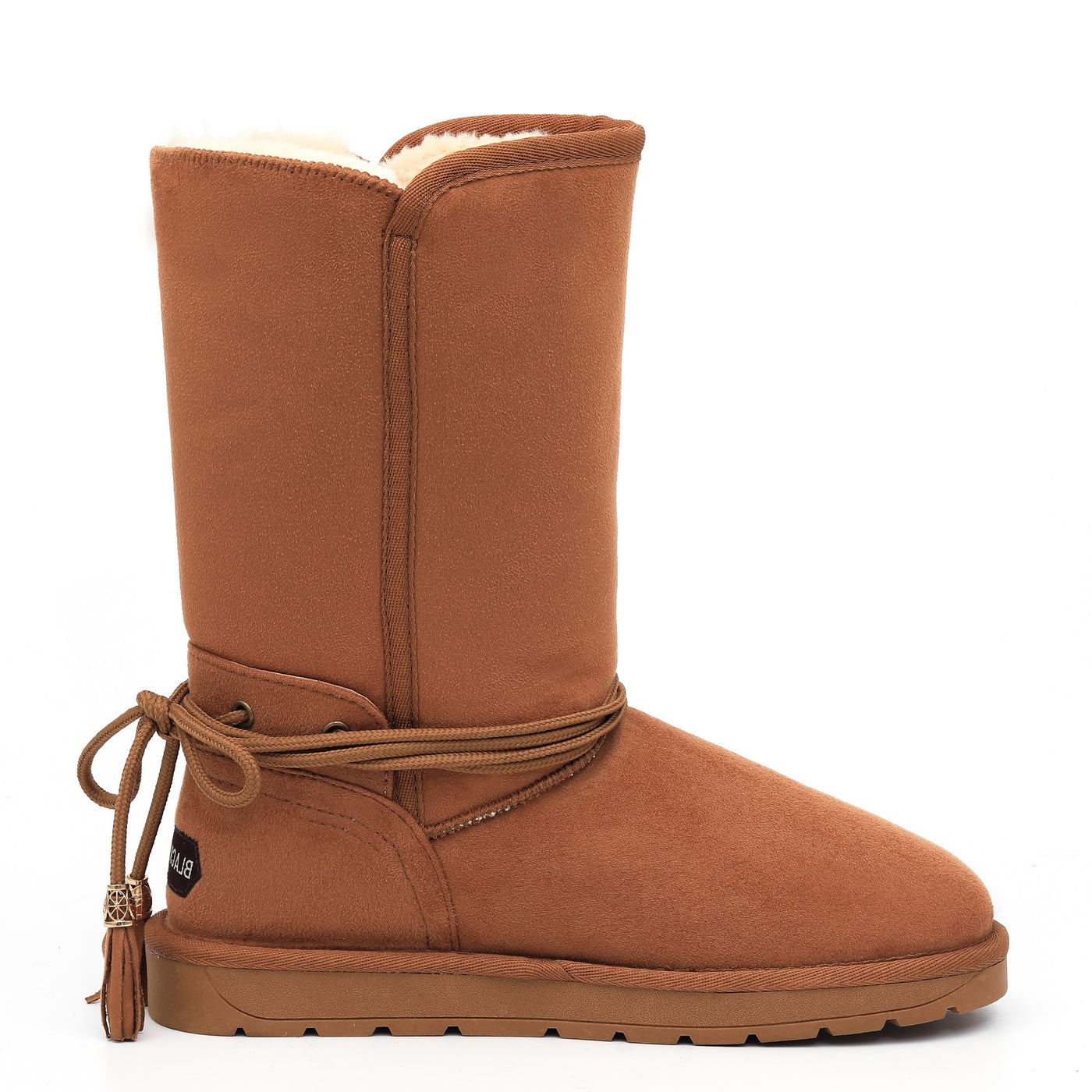 Botte fourrée haute Eowin camel de profil, glands à embouts dorés le long du cordon