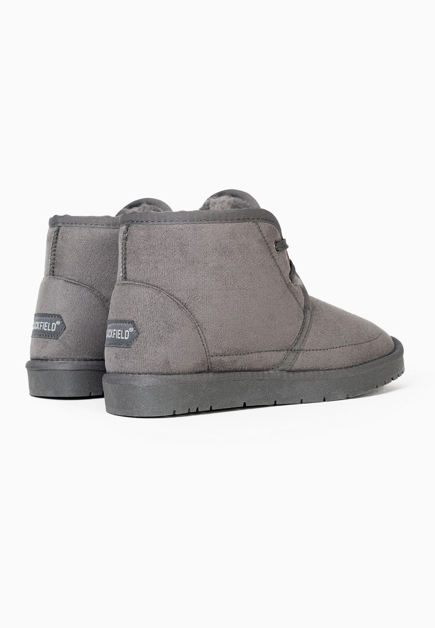 Paire de bottines fourrées Chanel gris foncé vue de dos, étiquettes aux talons