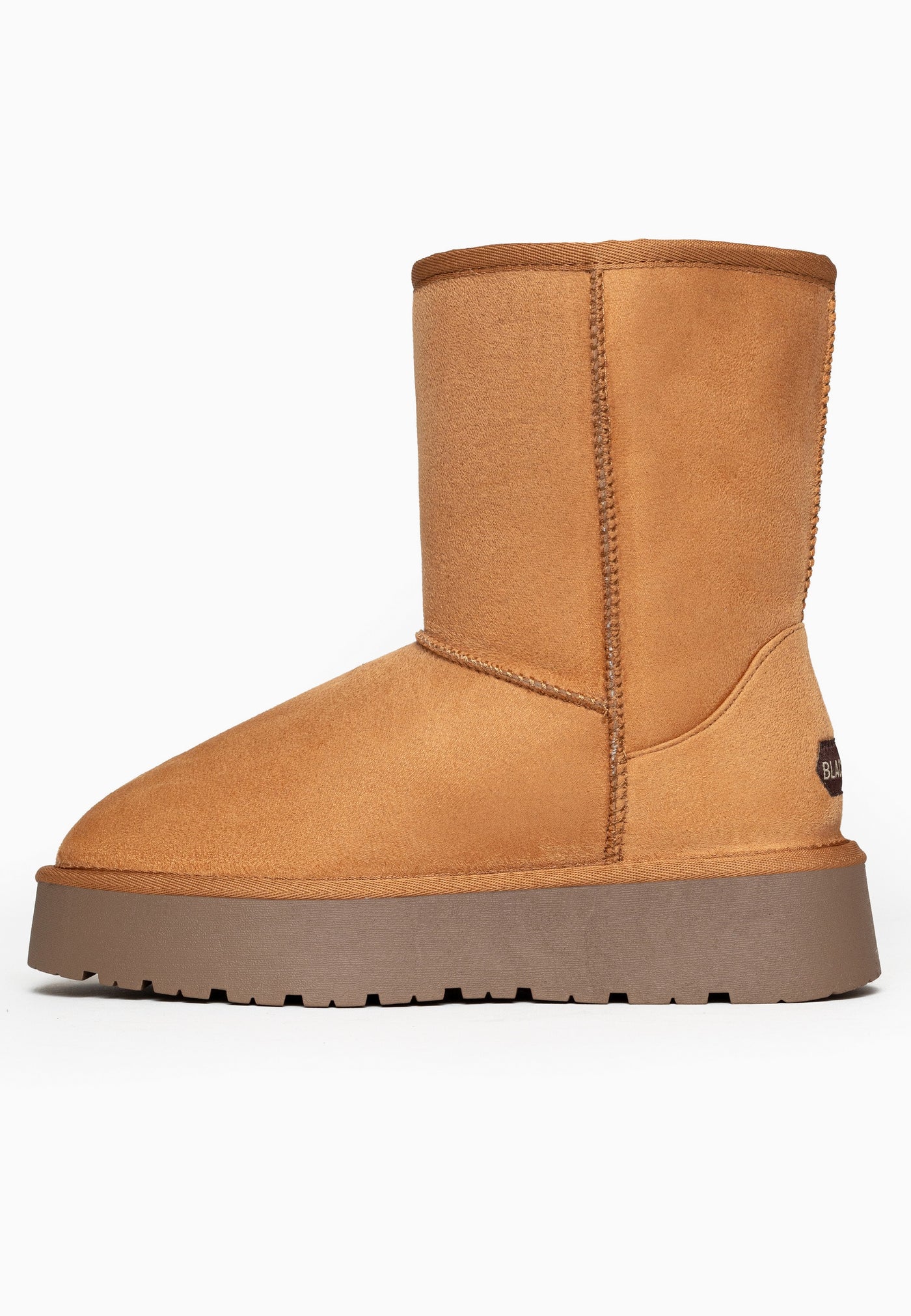 Bottine fourrée Joy camel de trois-quarts arrière, étiquette sombre au talon