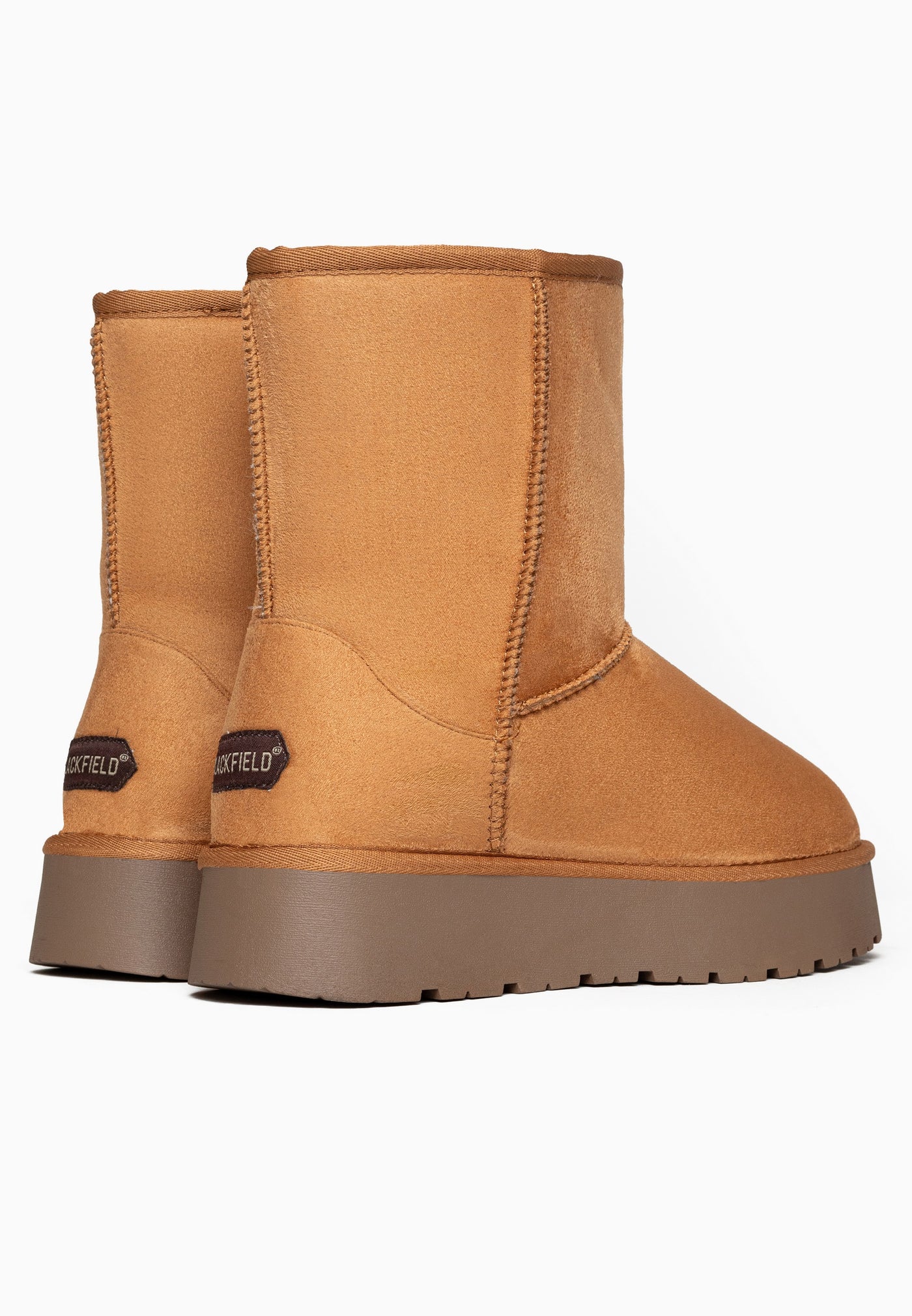 Deux bottines fourrées Joy camel vues de dos, coutures verticales sur la tige