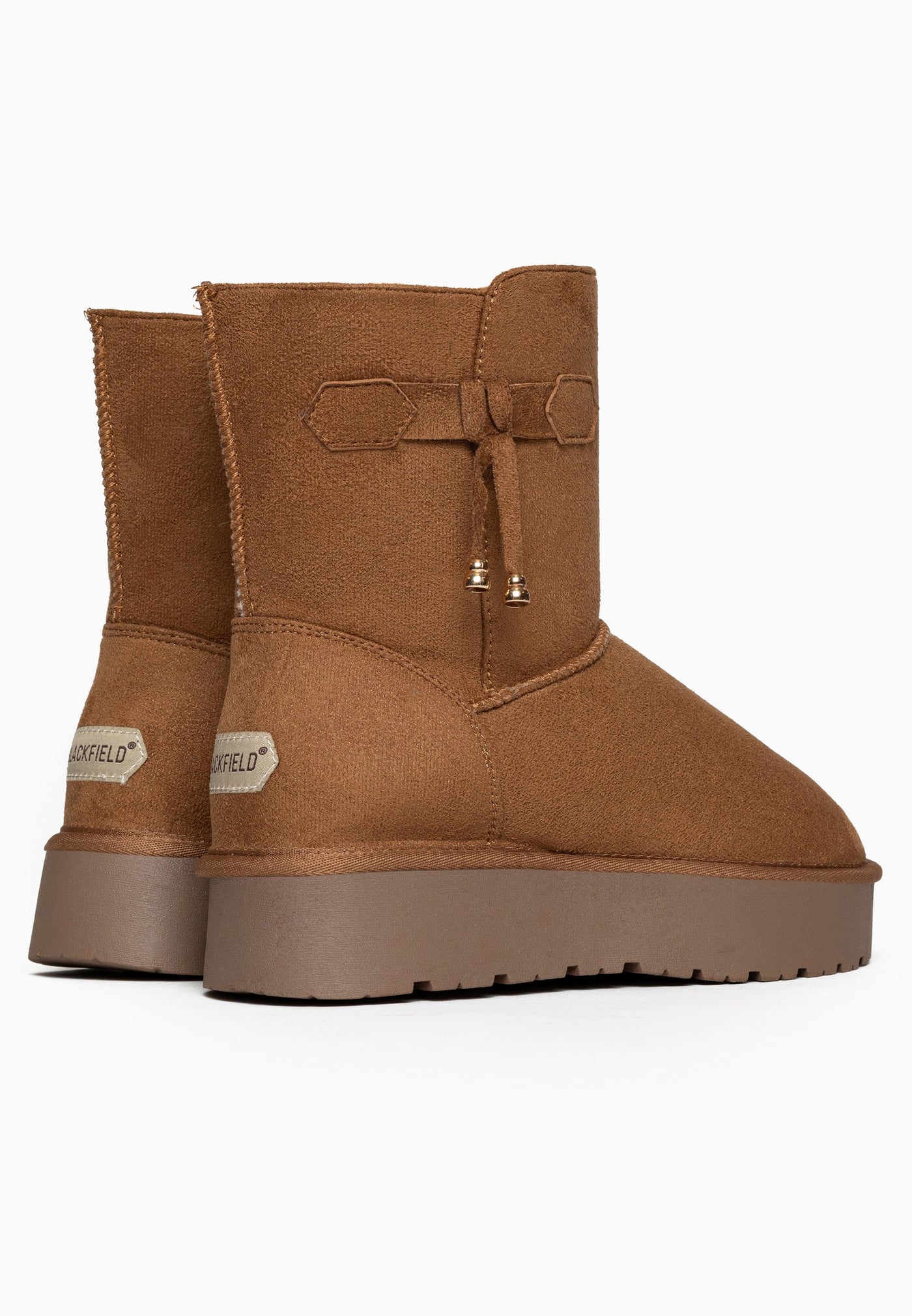 Bottines fourrées Opinaca camel de dos, étiquettes claires cousues au bas des talons