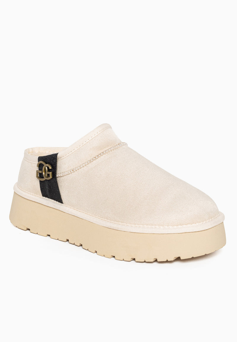 Bottine fourrée Edila blanc cassé de profil, bande noire et boucle de bronze
