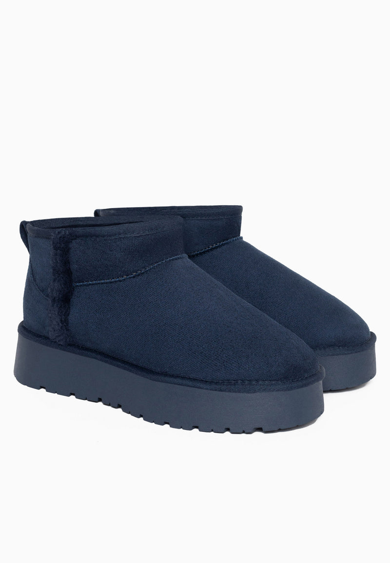 Bottines fourrées Brizz marine en paire, liseré de fausse fourrure marine au quartier