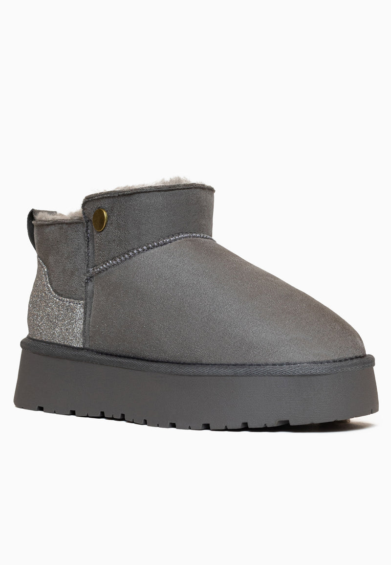 Bottine fourrée Edeh anthracite de profil, bouton bronze et empiècement pailleté