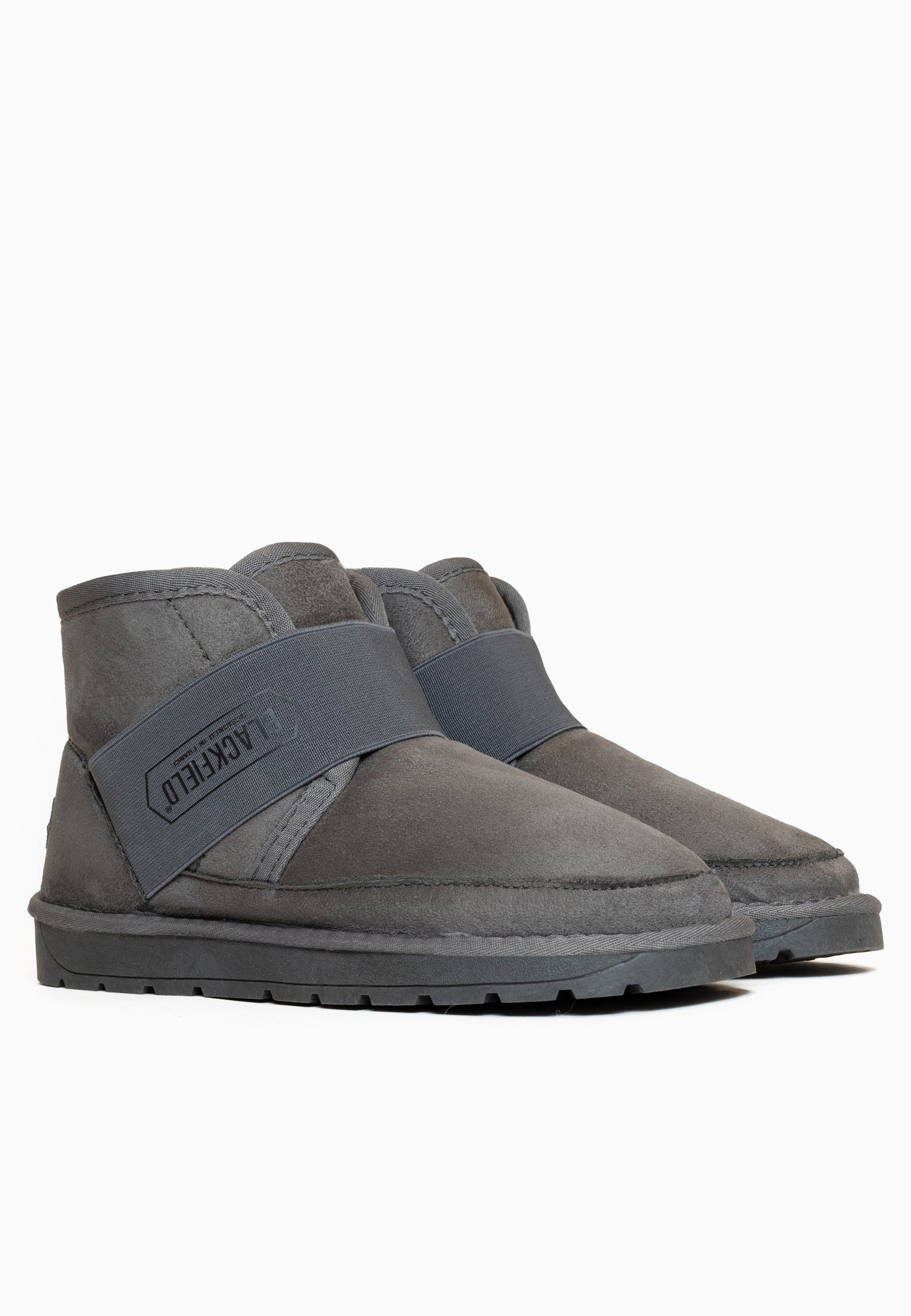 Deux bottines fourrées Eshika anthracite posées de trois-quarts, bandes en travers