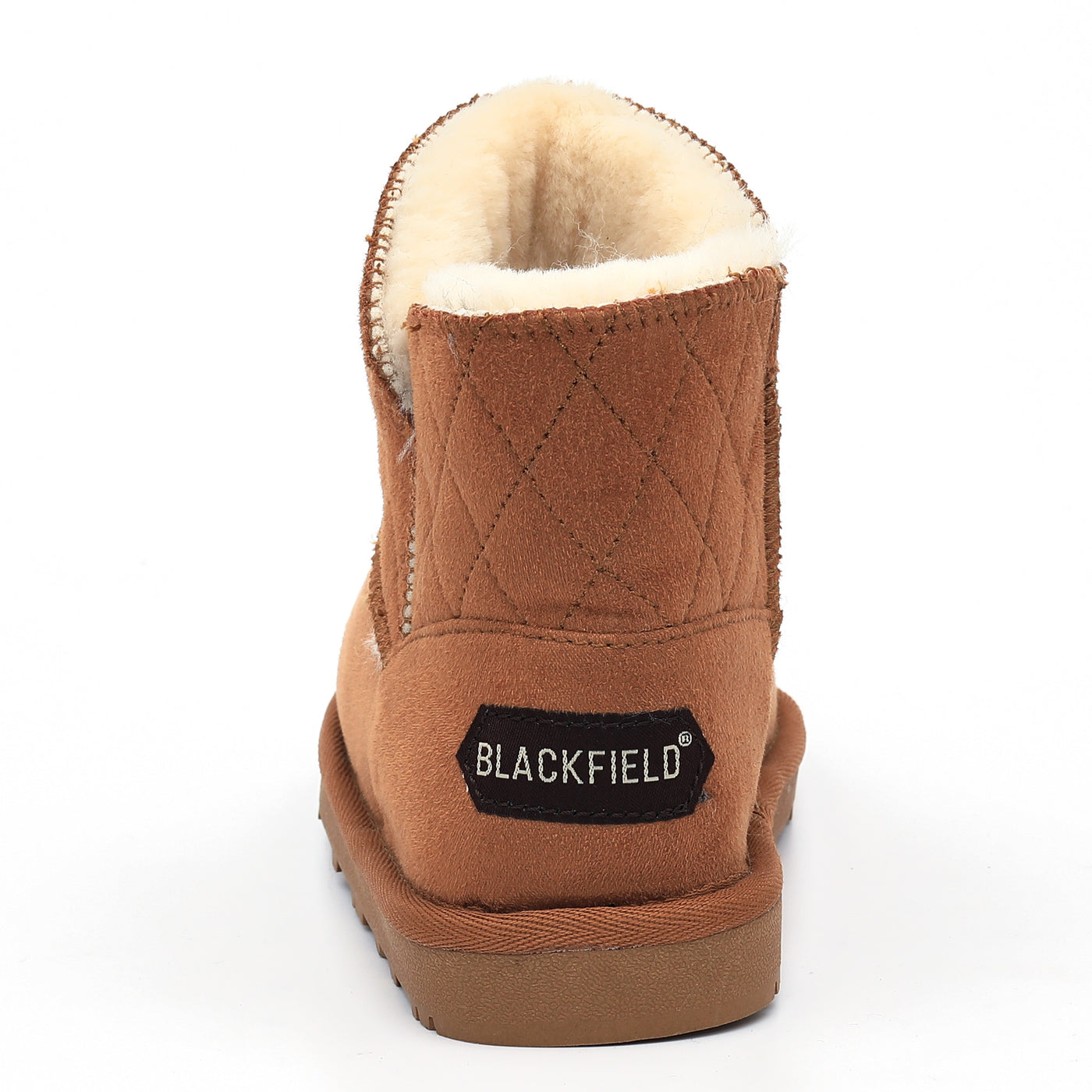 Botte fourrée enfant Tinke camel de dos, étiquette noire au talon et doublure crème