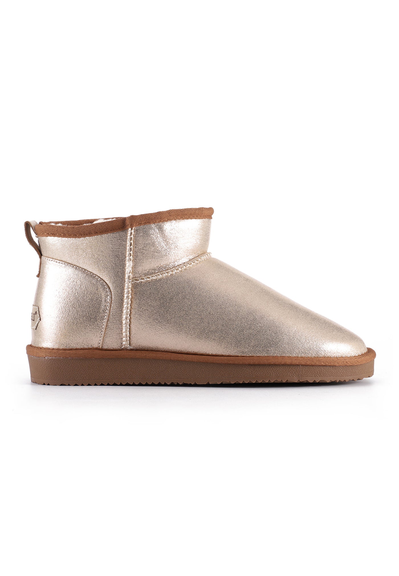 Bottine fourrée Mini Milli beige de profil, semelle caramel crantée et tirette au talon