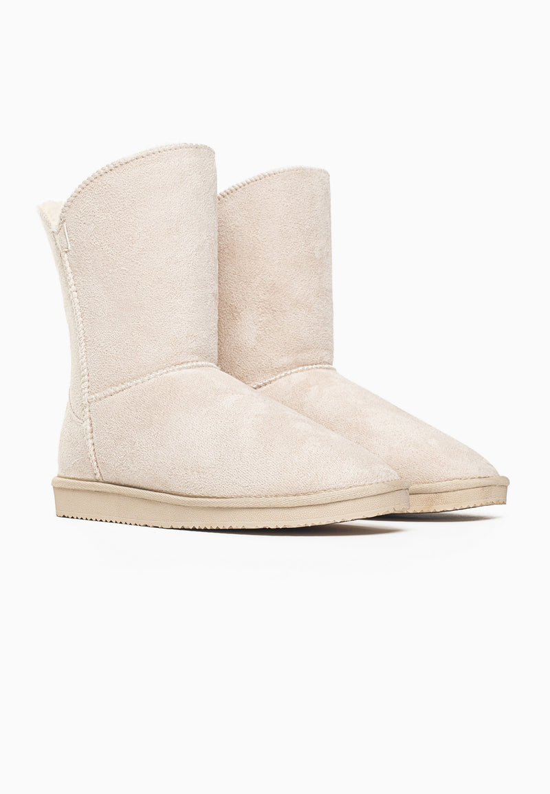 Paire de bottines fourrées Ocean naturel de trois-quarts, col fendu en V au bord