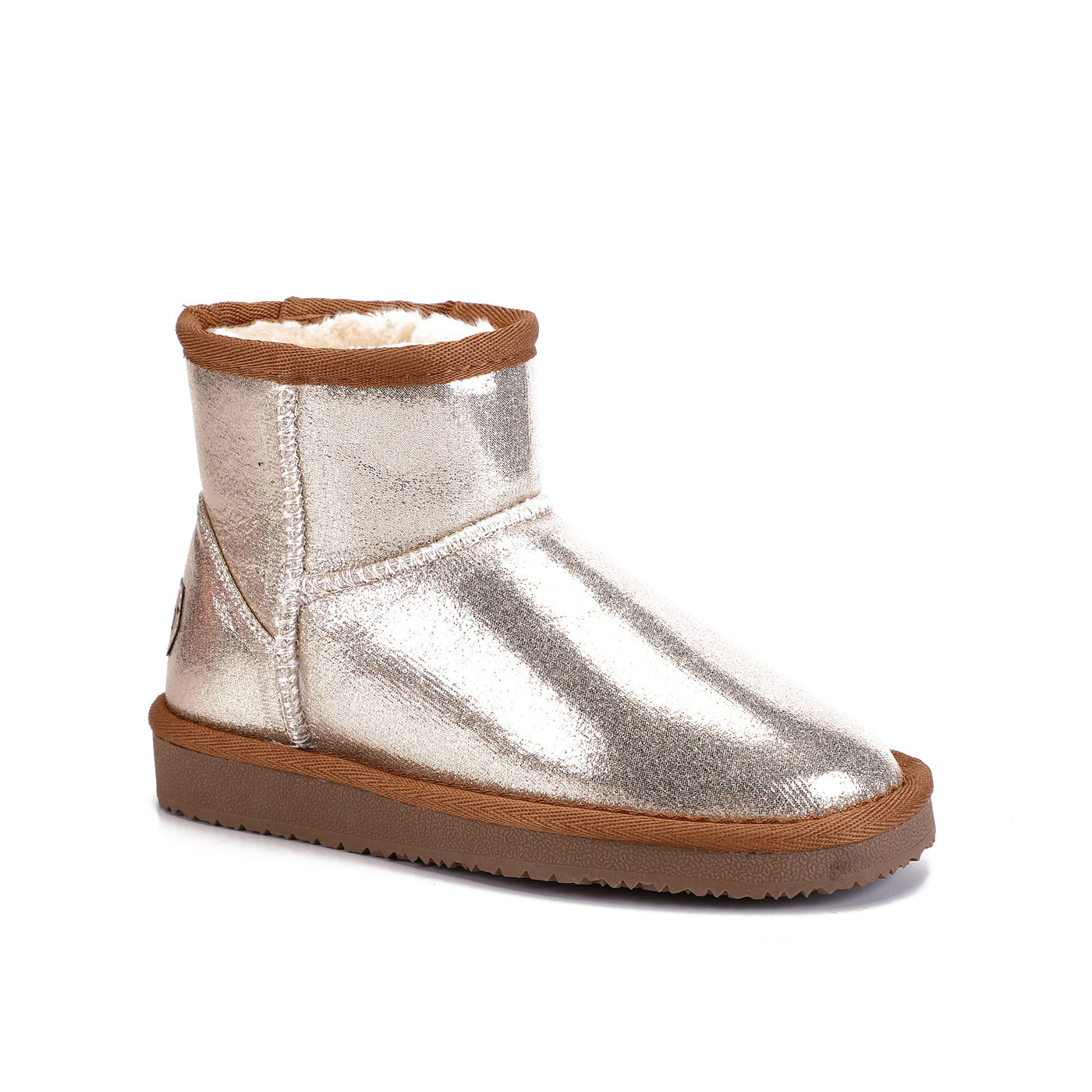 Botte fourrée enfant Agnes beige de profil, finition métallisée et bord camel contrasté