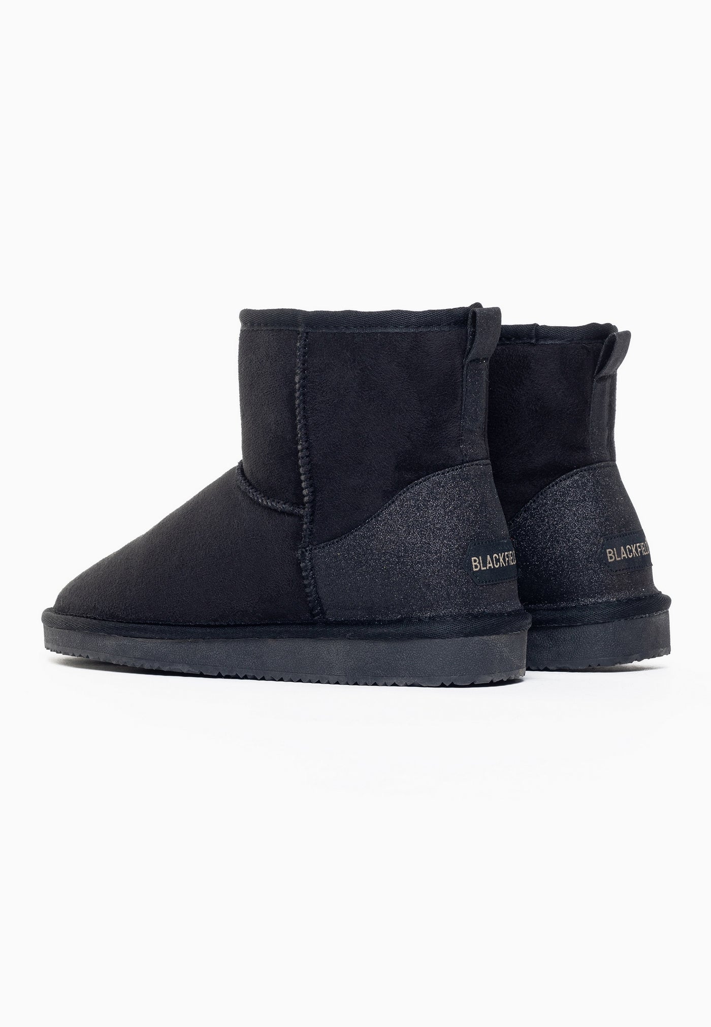 Paire de bottines fourrées Casablanca noires vue de dos, étiquettes dorées aux talons