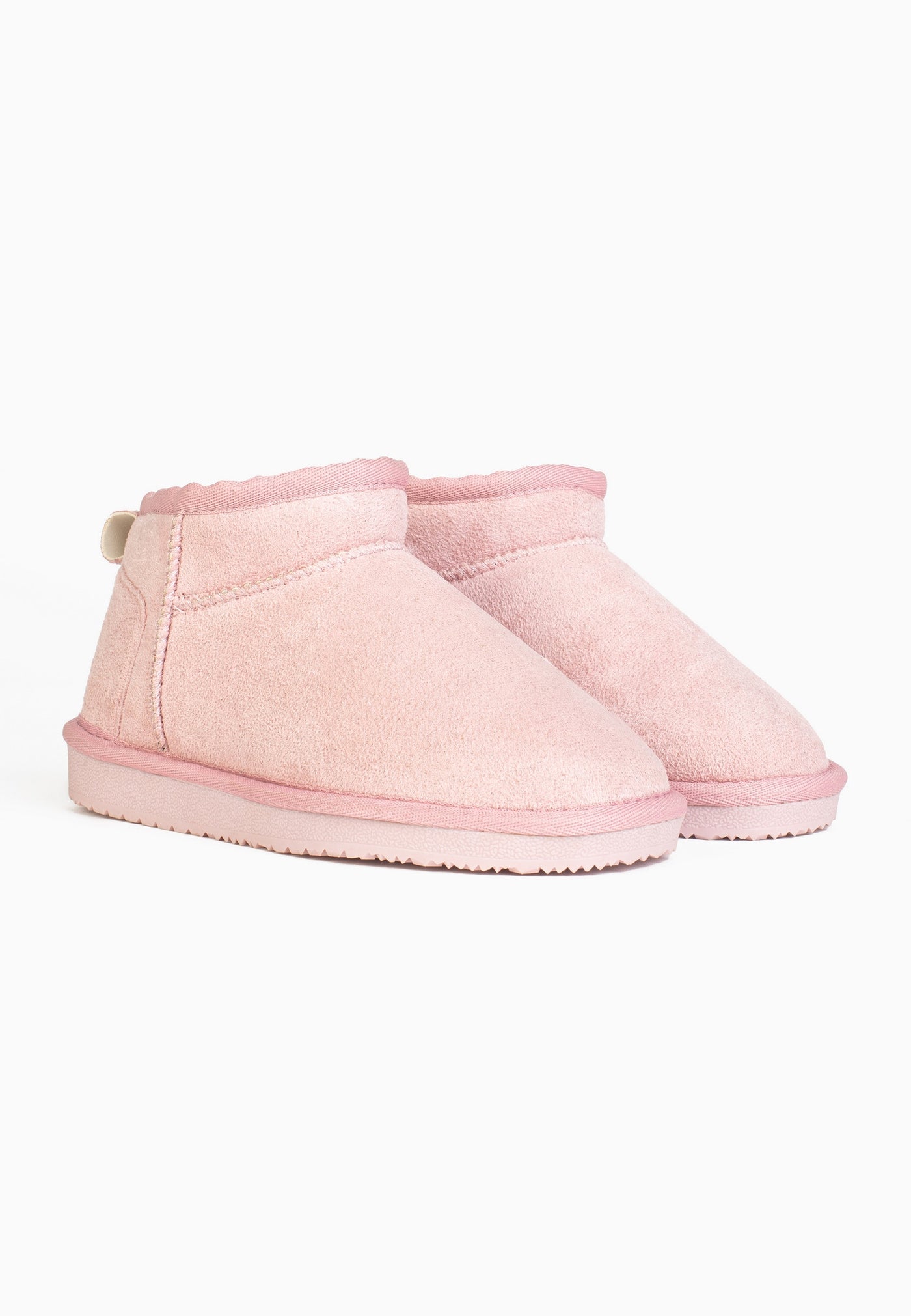 Deux bottines fourrées Mikela rose en paire, tirettes beiges cousues aux talons