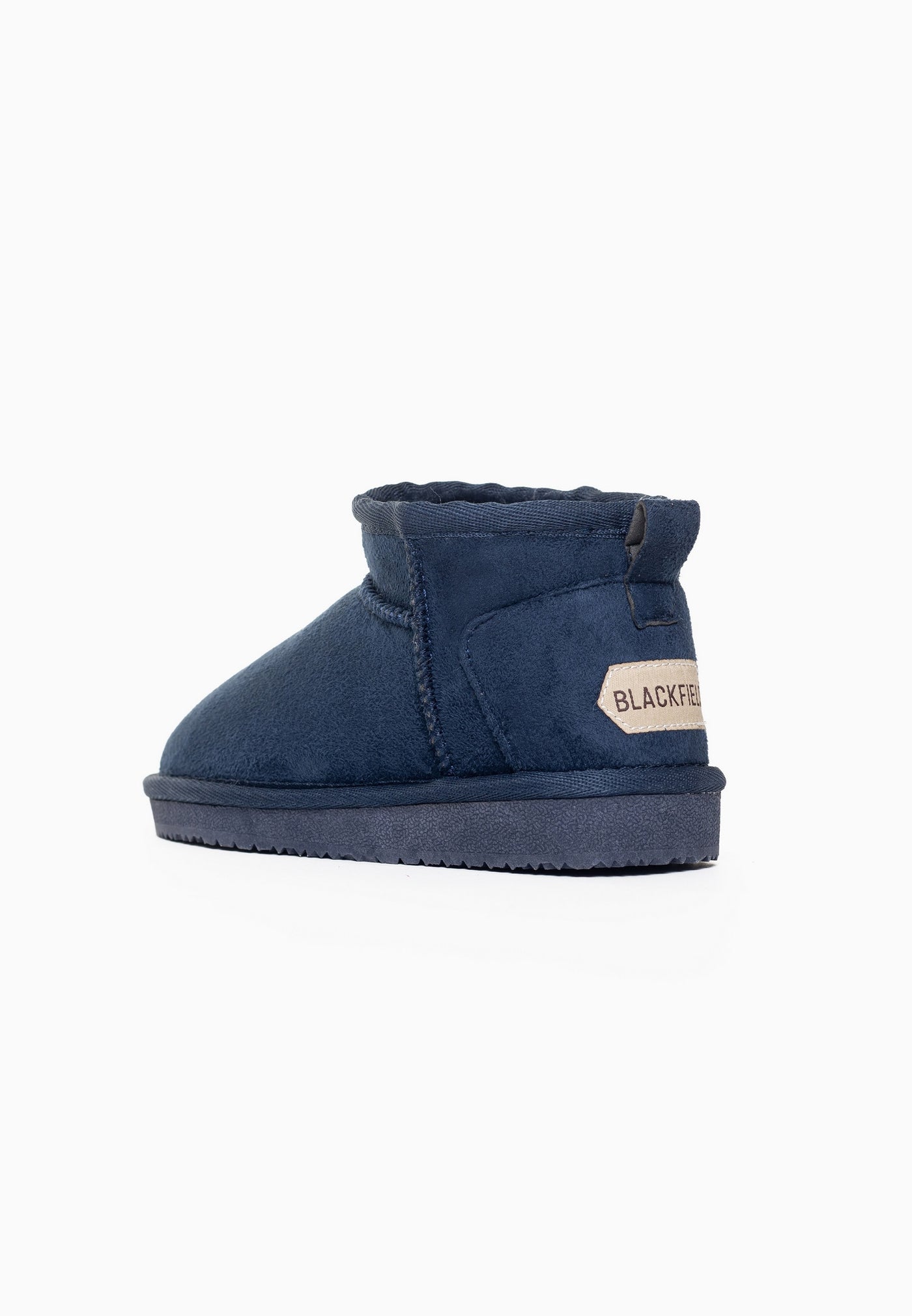 Botte fourrée enfant Mikela marine de trois-quarts arrière, étiquette beige cousue au talon