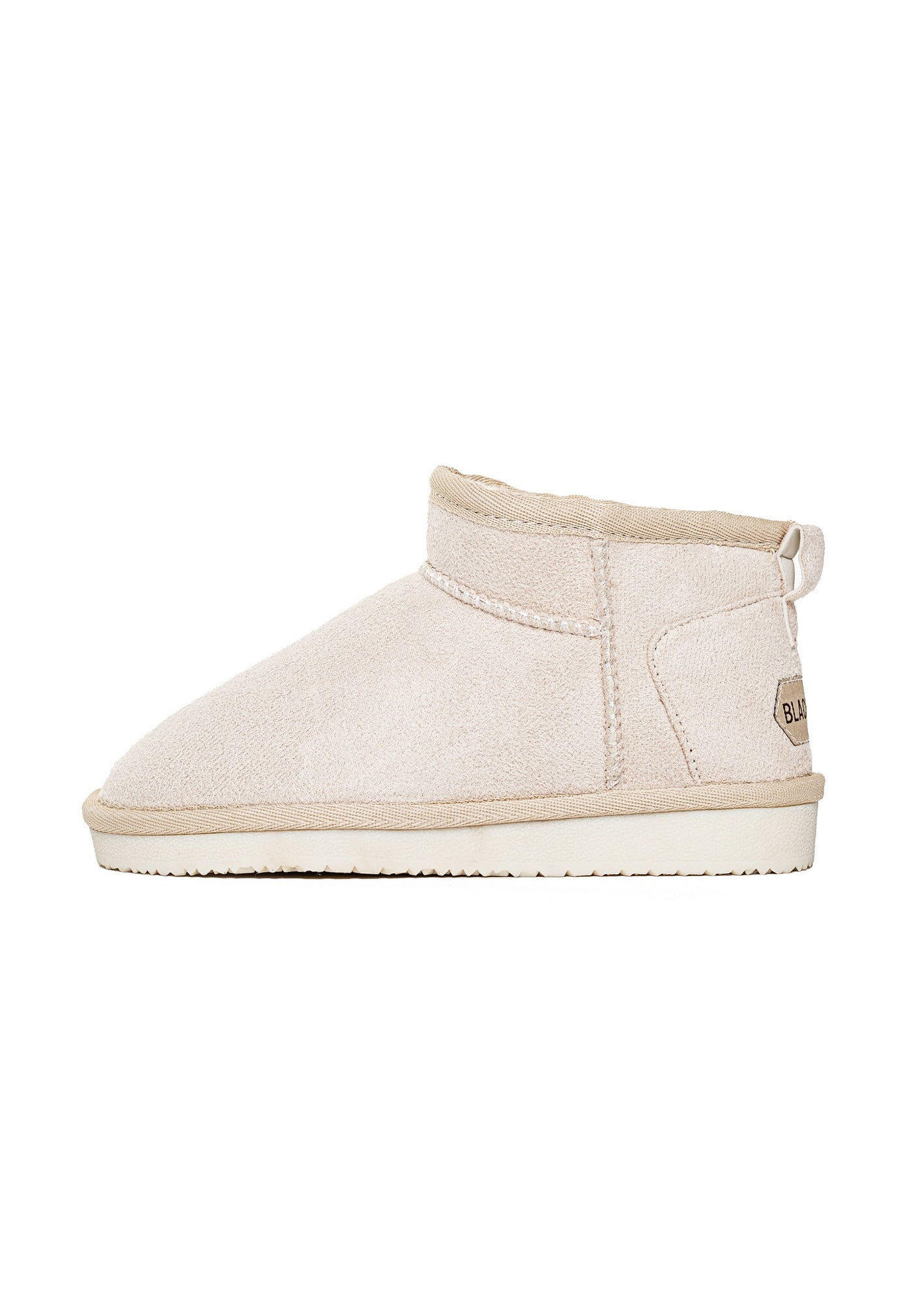 Bottine fourrée Mikela naturel de profil, étiquette beige cousue au talon