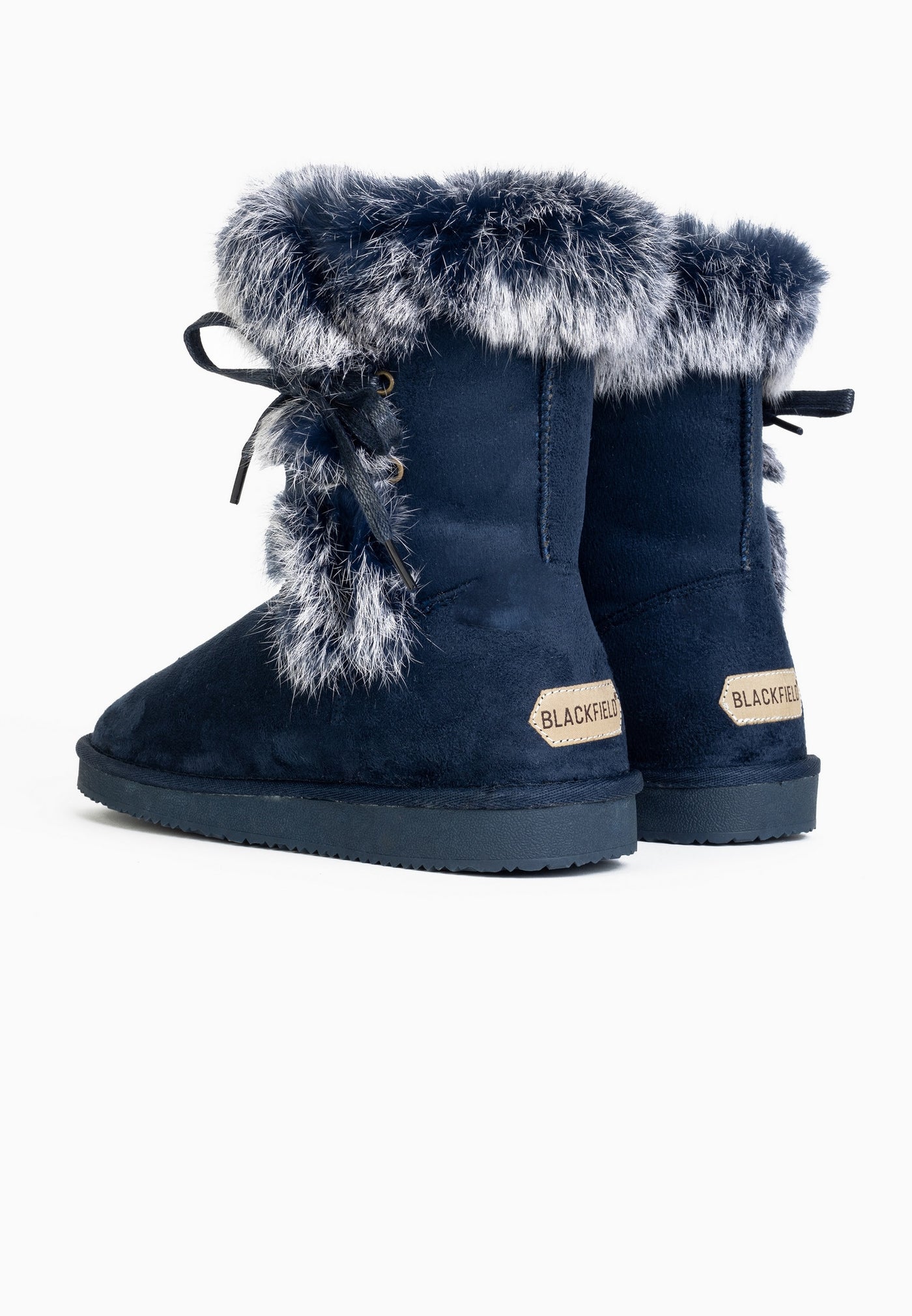 Deux bottines Mi-mollet Chuckson marine fourrées de dos, étiquettes beiges aux talons