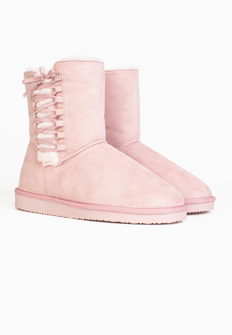 Paire de bottines fourrées Nueltin rose de trois-quarts, ruban noué et semelle assortie