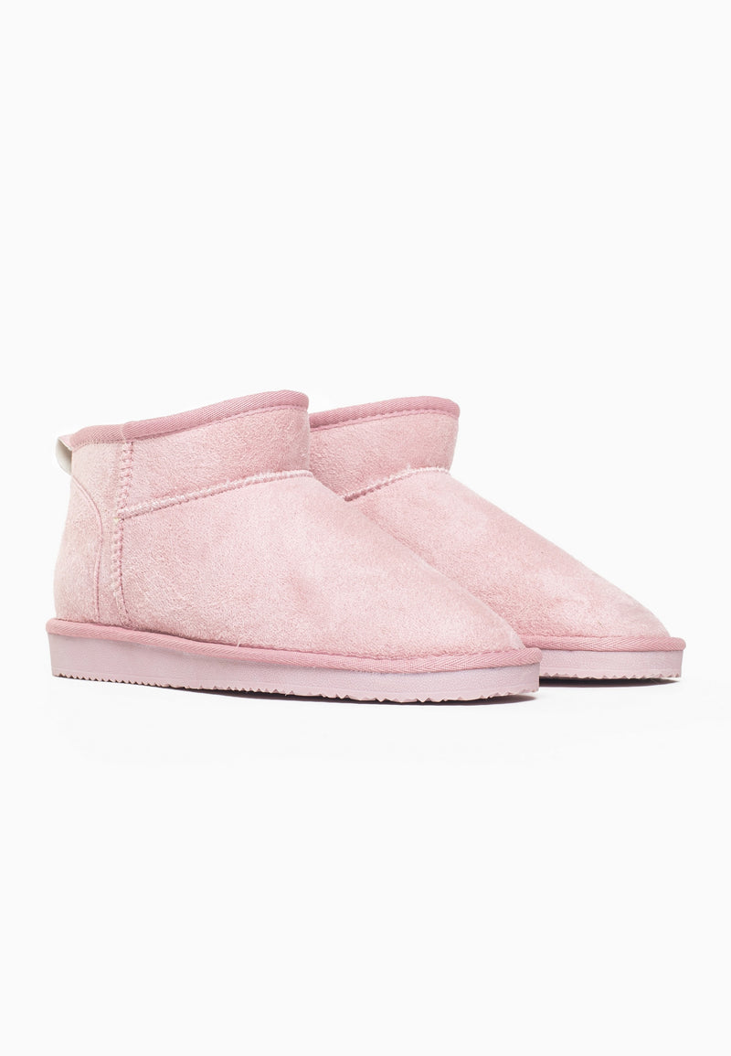 Paire de bottines fourrées Mini Milli rose poudré vue de trois-quarts, semelles assorties