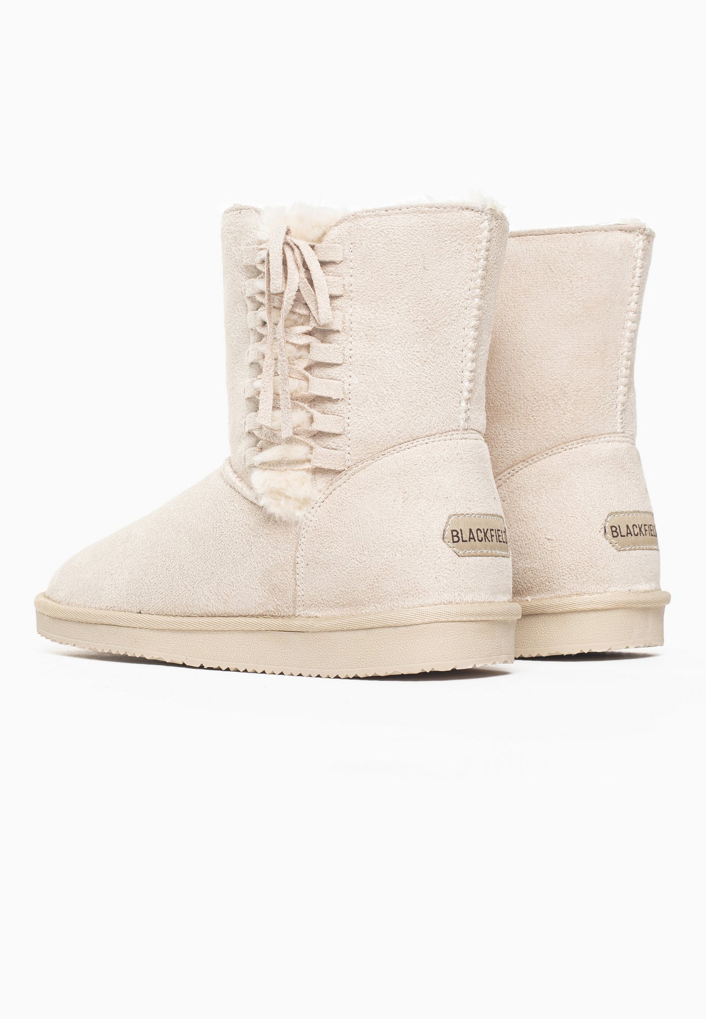 Paire de bottines fourrées Nueltin naturel de dos, étiquettes Blackfield aux talons