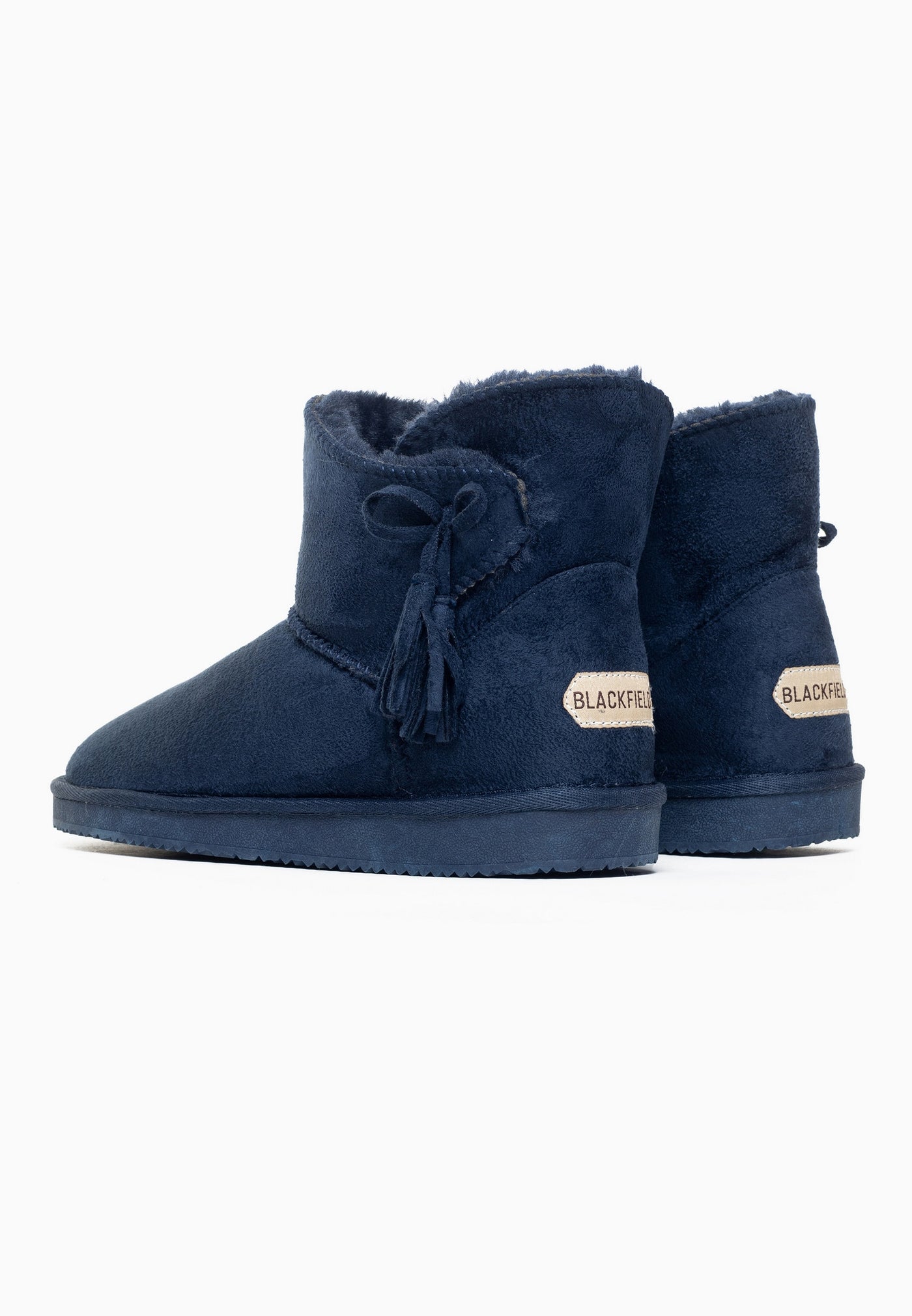 Paire de bottines fourrées Curry marine vue de dos, étiquettes claires aux talons
