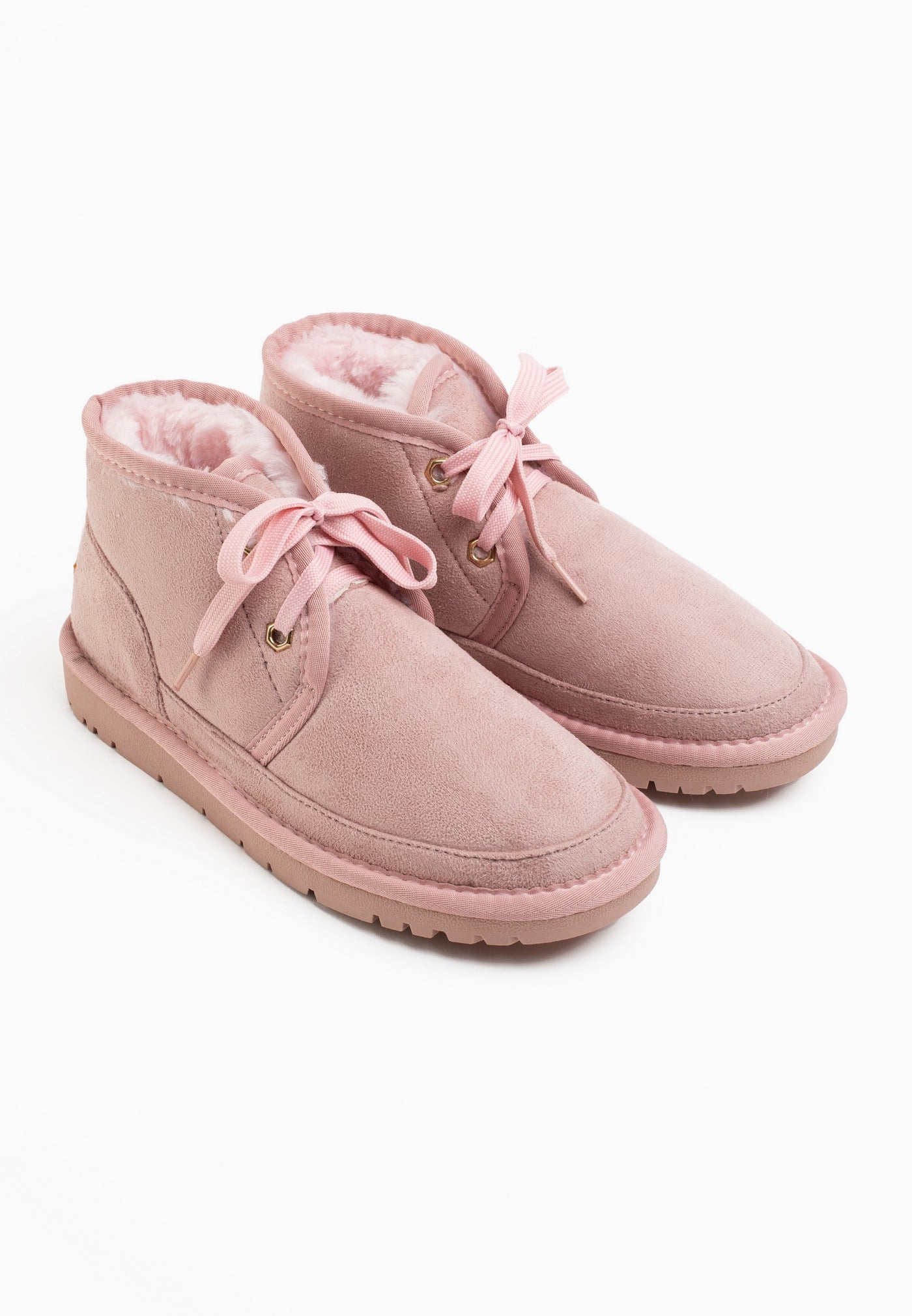Paire de bottines fourrées Citrine rose de trois-quarts, doublure rose à l'ouverture