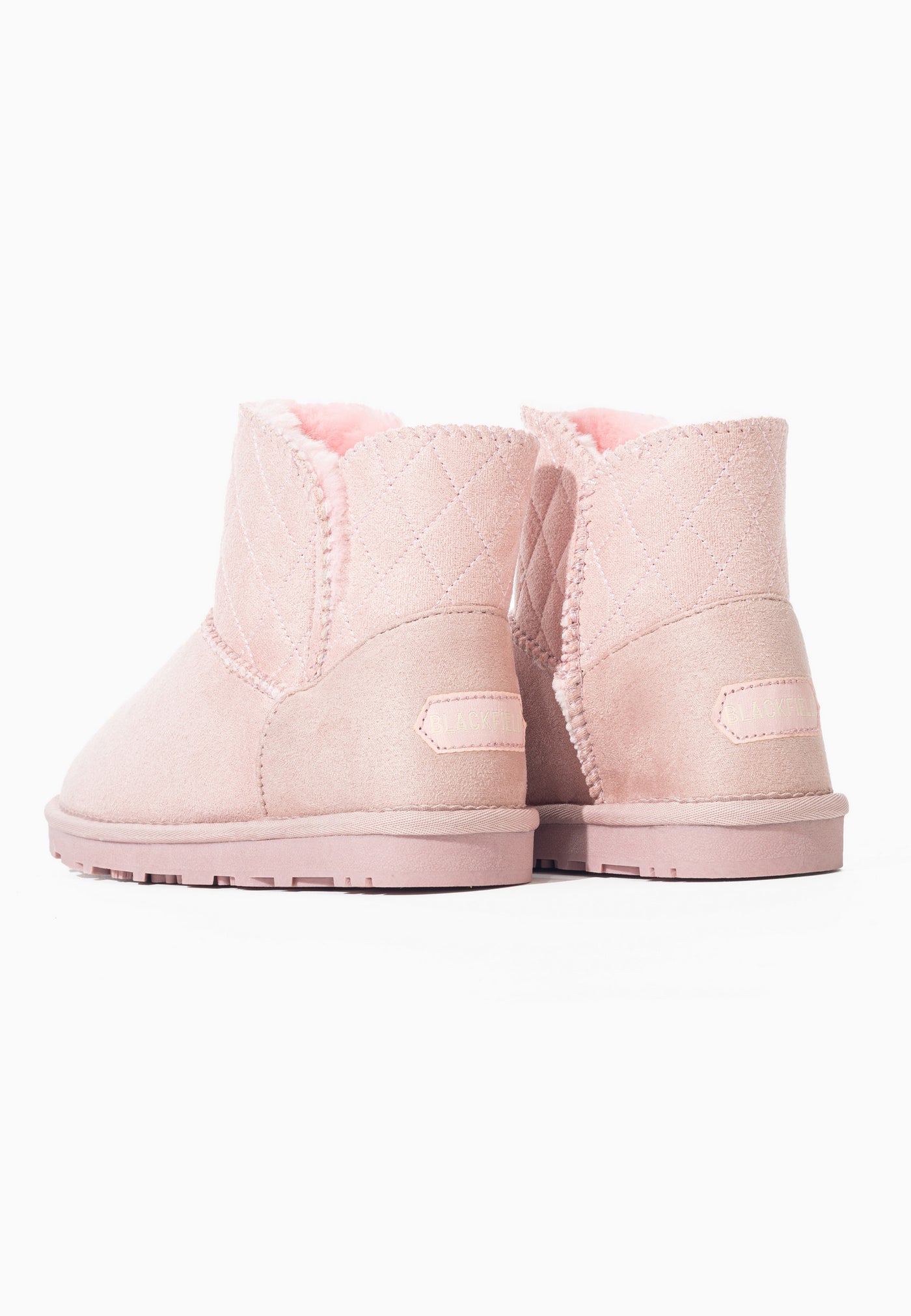 Bottes fourrées Tinke rose vues de dos, doublure rose visible aux ouvertures