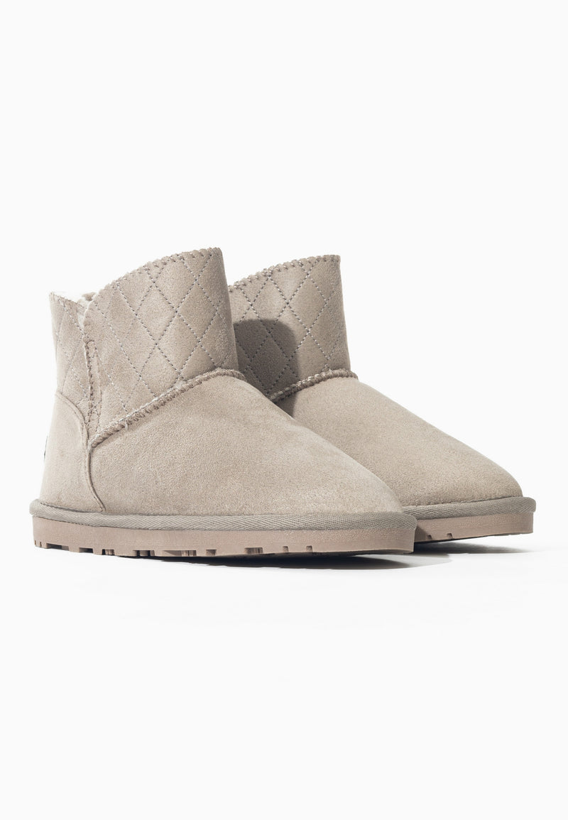 Paire de bottes fourrées Tinke naturel de trois-quarts, empiècements matelassés