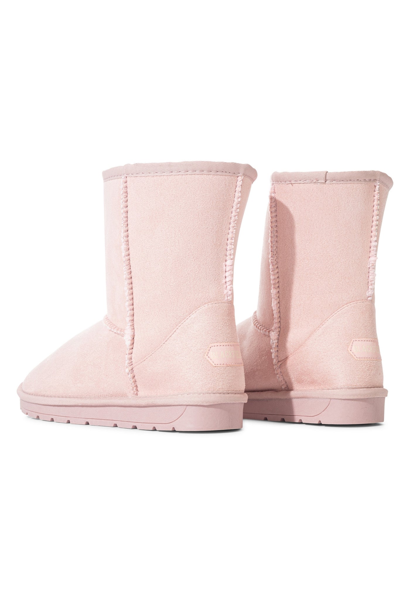 Bottes fourrées Joy rose vues de dos, couture verticale du talon et étiquette