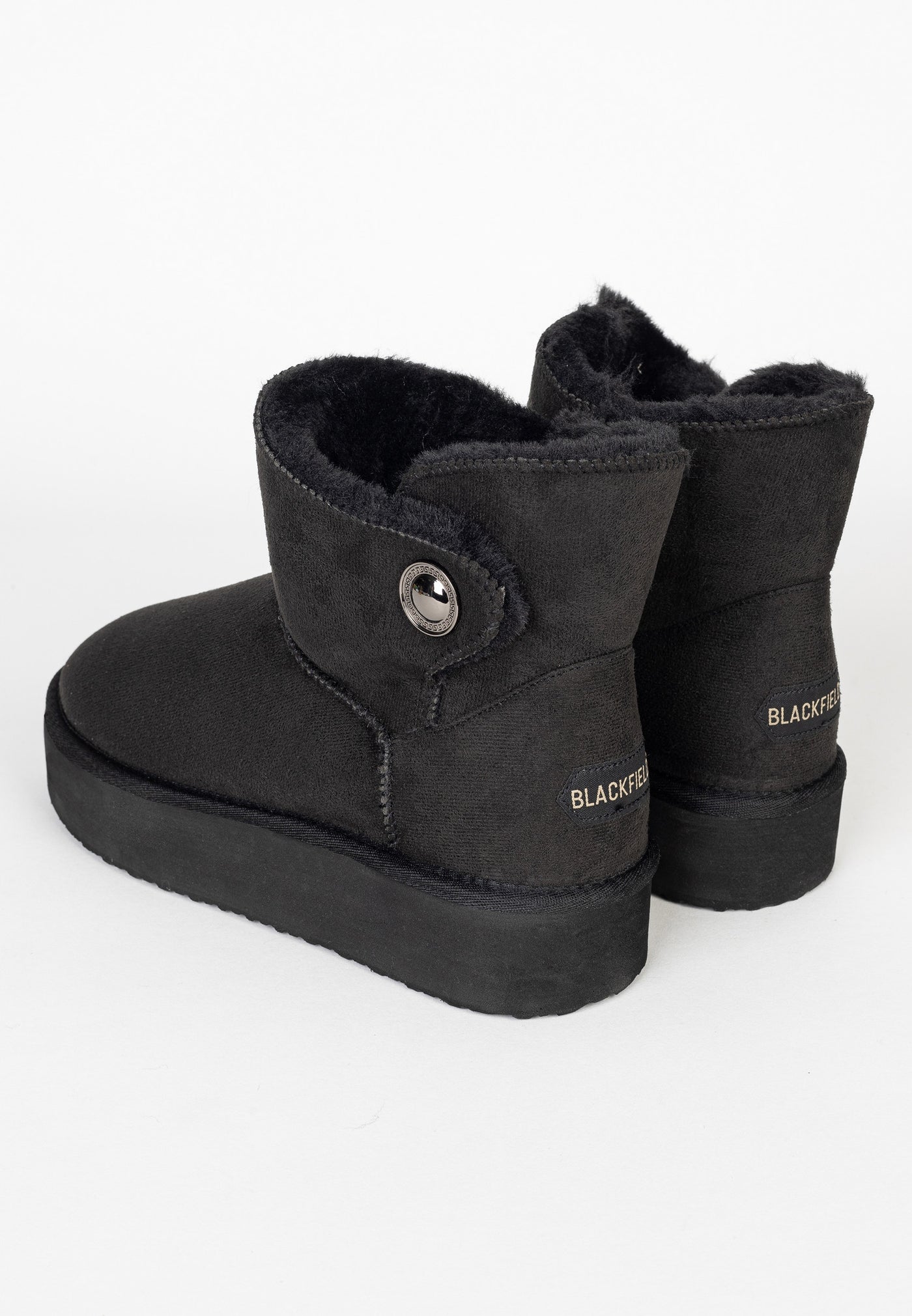 Paire de bottines fourrées Cayuga noires de dos, contreforts et coutures apparentes