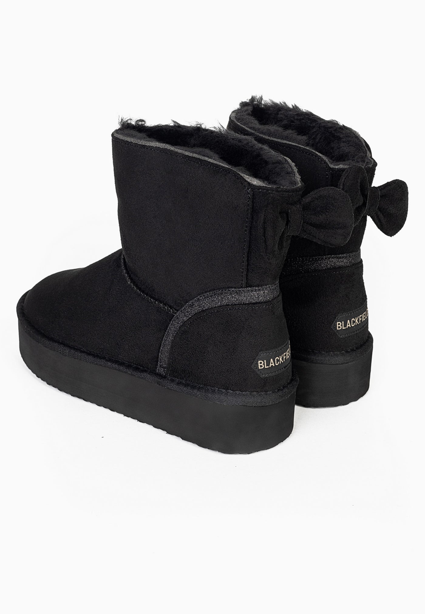 Paire de bottines fourrées Champlain noires de dos, deux nœuds au-dessus des talons